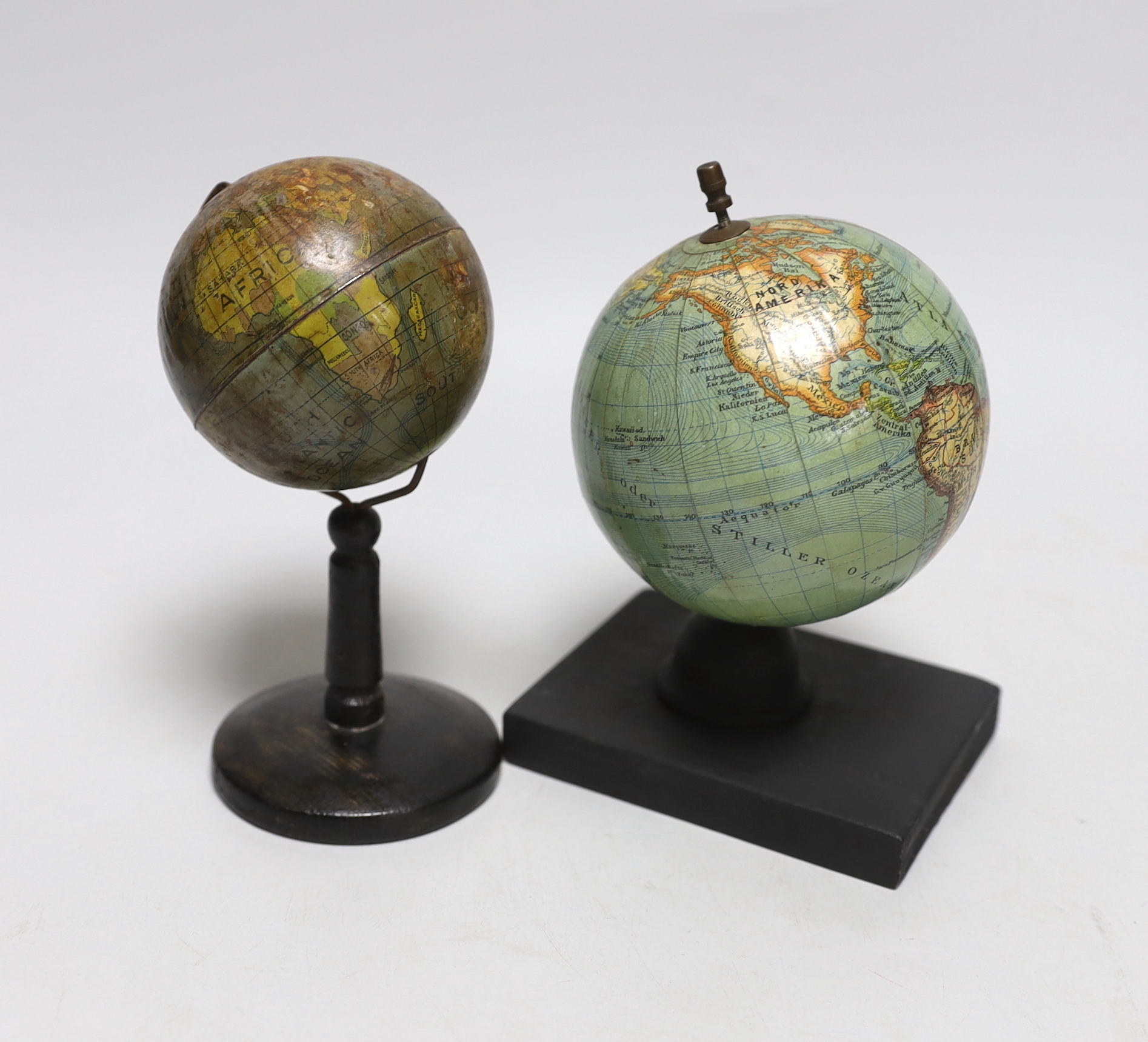 A small German globe on stand and another, tallest 16cm high